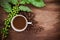 Cup coffee and beans on wood background
