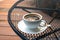 A cup of coffee on Black steel grating table