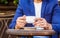 Cup of coffee. Cappuccino and black espresso coffe cup. Coffee drink. Close up of a man hands holding a hot coffe cups