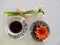 Cup of coffee, chocholate muffin with orange flower, snowdrops, from above