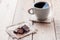 Cup coffee with chocolat on wooden table and black background