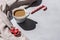 A cup of coffee and Christmas decorations on a gray table with a hard shadow. Christmas, winter concept