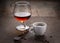 Cup of coffee, cognac glass and coffee beans