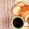 Cup of coffee, crackers and fresh croissant
