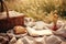 Cup of coffee, croissant, book and wicker basket on plaid outdoors, Picnic on the grass. A wicker basket with milk and bread,