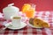 Cup of coffee, croissant, orange juice and a sugar bowl