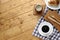 A cup of coffee with croissant on wooden table