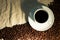 Cup of coffee on crumpled sackcloth