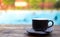 Cup of coffee on deck near Swimming pool