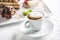 Cup of coffee and dessert on plate in cafe confectioners or res