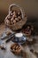 Cup of coffee, different kinds of nuts, walnut, hazelnuts, almonds on old wooden table boards, edible seed kernels, food concept,