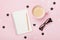 Cup of coffee, eyeglasses, pencil and clean notebook on pink table top view. Flat lay style. Woman blogger working desk.