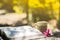 Cup of coffee with flower desk,soft focus background blur book