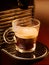 Cup of coffee with foam home espresso automatic machine closeup morning