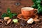 Cup of coffee with french macaroons cookies on dark  background