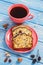 Cup of coffee and fresh baked fruitcake on boards