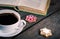 Cup Of Coffee with Gingerbread cookies and book on wooden background