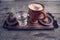 Cup of coffee, a glass of water and cookies on the wooden table.