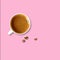 Cup of coffee and golden beans on a pink background top view, minimalism, collage