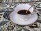 A Cup of Coffee on Indonesian Ornamental Backgroundon.