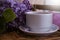 Cup of coffee, lilac natural lifestyle  in the apartment romantic floral