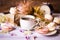 Cup of coffee with macaroons, dried flowers protea
