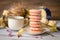 Cup of coffee with macaroons, dried flowers protea