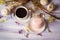 Cup of coffee with macaroons, dried flowers protea