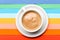 Cup of coffee with milk or cappuccino beverage on colorful as rainbow background. Dose of energy concept. Coffee on