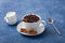 Cup of coffee milk seeds spoon cinnamon anis