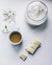 Cup of coffee with milk, sugar, white chocolate, flowers