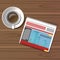 Cup of coffee, newspaper on wooden table