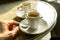 Cup of coffee in a nice hipster cafe. Soft focused image.