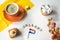 Cup of coffee, orange cake and eclair. Traditional treat for Dutch event Kings Day, Koningsdag