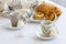 Cup of coffee with pasticciotto pastry on a white background, italian traditional breakfast, Salento
