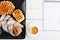 Cup of coffee and pastry on white wooden table. Top view.