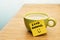 Cup of coffee, post-it note good morning and smiley