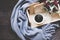 Cup of coffee on rustic wooden serving tray in the cozy winter with blanket. Knitting warm wooden sweater in the winter weekend,