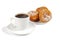 A cup of coffee and saucer with donuts