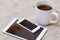 Cup of coffee, smart phone and tablet