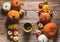 Cup of coffee and some pumpkins on wood background