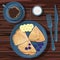 Cup of coffee, sour cream, pancakes folded in triangle with banana and blueberries on blue plate isolated on wooden table.