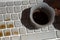 Cup of coffee spilling onto a laptop keyboard