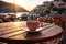 A cup of coffee on a table of outdoor restaurant in small seaside town in Italy. Having breakfast coffee in Italian scenery on