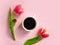 Cup of coffee. tulip flower on colored background greeting