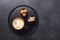 Cup of coffee, various sweets and spice on ceramic plate. Top view. Copy space