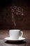 Cup of coffee with woman-shaped smoke