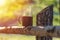 Cup with coffee on wood fence over mountain forrest landscape wi