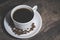 Cup of coffee on wooden table, top view