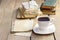 Cup of coffee on wooden table. Vintage books and pile of letters